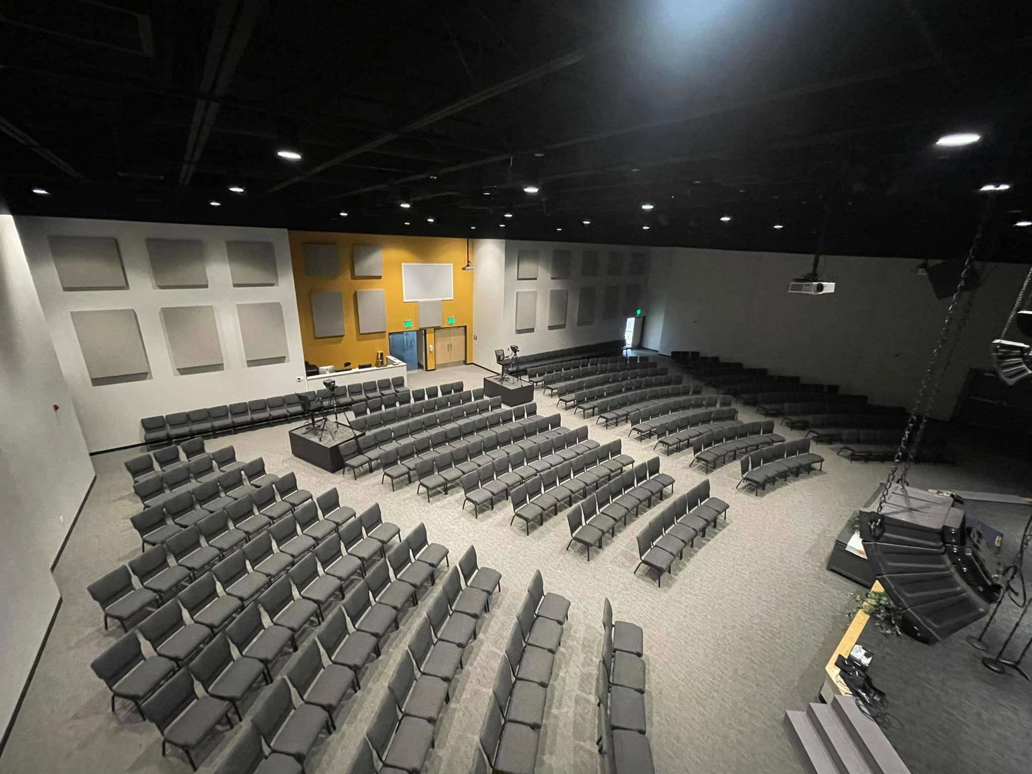 The auditorium — black, white & gold